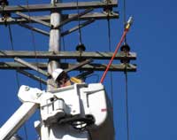 Lineman uses ultrasonic detector 